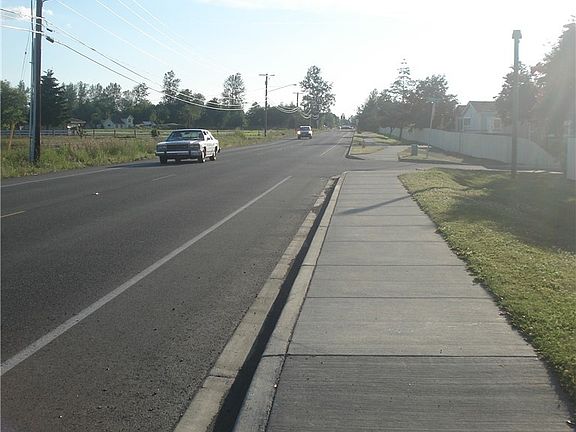 sidewalk facing West
