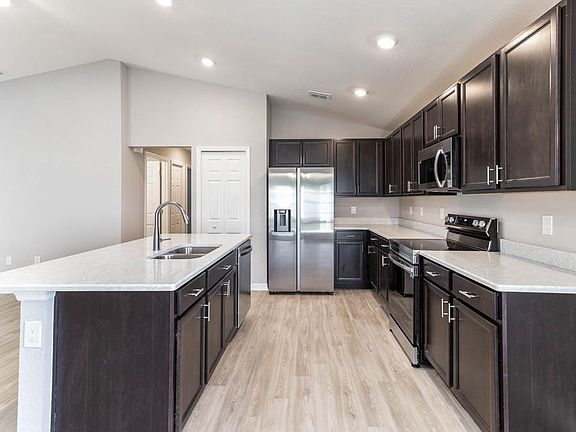 Your beautiful new kitchen includes luxurious quartz counters, Samsung SS appliances, and 36-in. woo