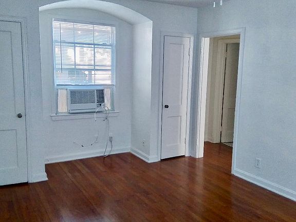 Spacious living room with wood floors