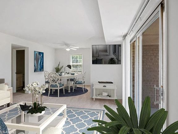 Bright living space with ceiling fan