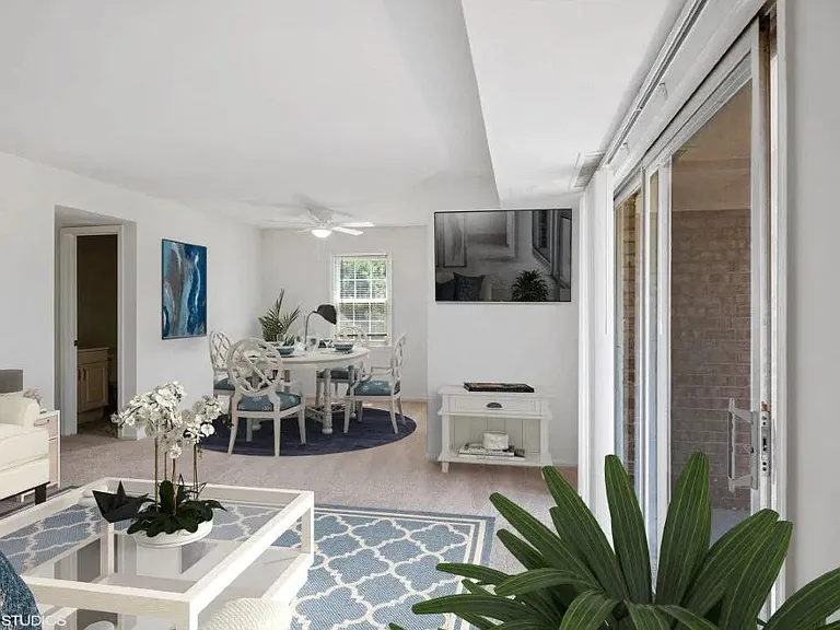 Bright living space with ceiling fan