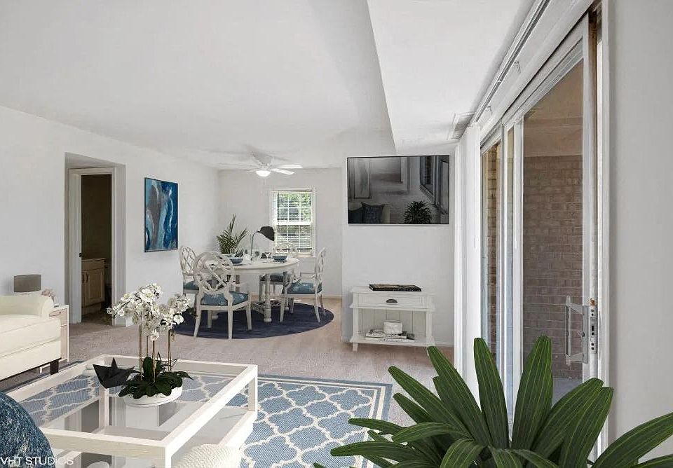 Bright living space with ceiling fan