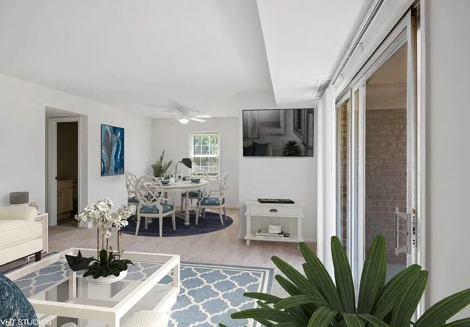 Bright living space with ceiling fan