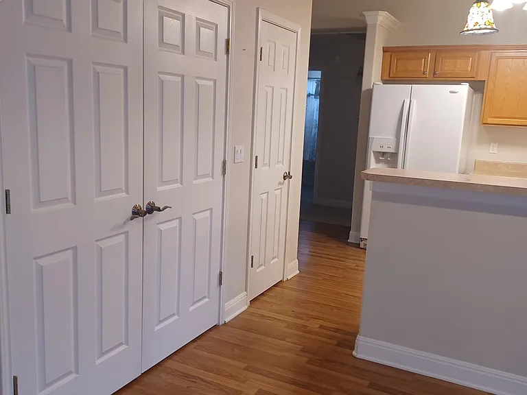 Laundry Closet and Pantry on Left