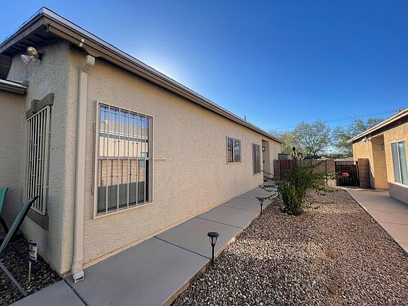 Sidewalk towards front door and backyard