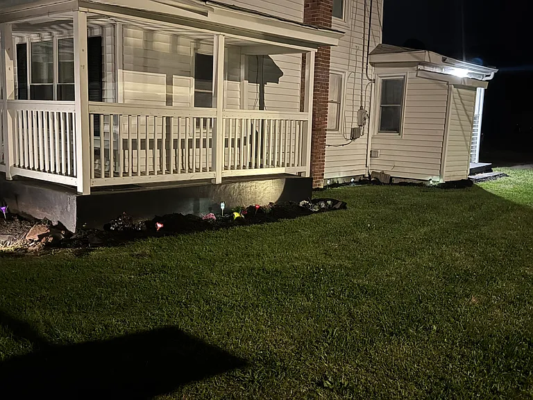 Right side night view of house