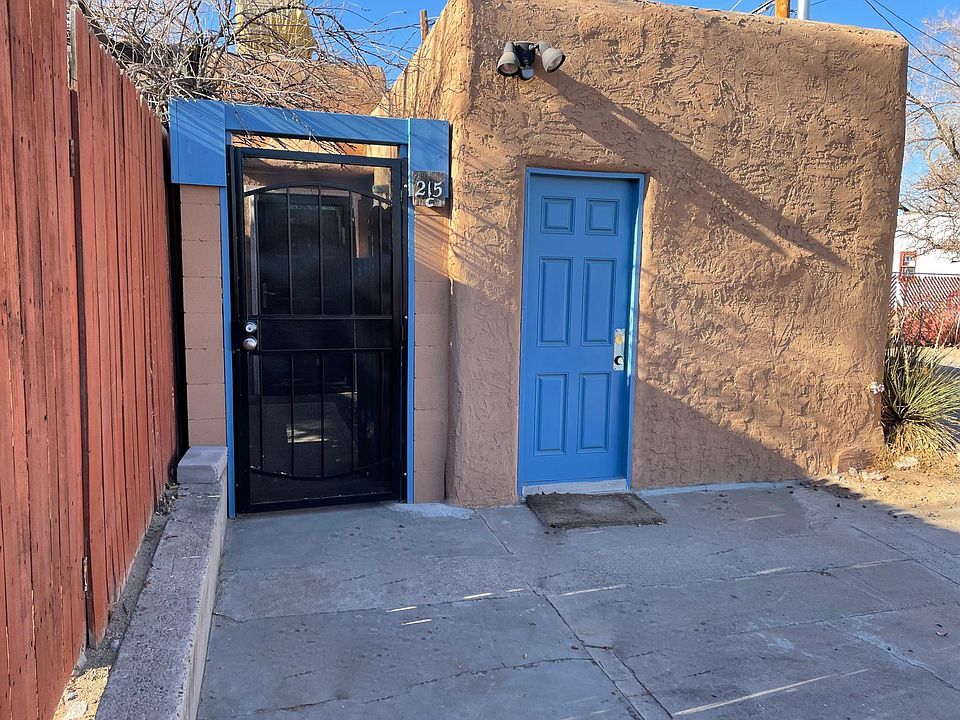 Security Gate Entry off Parking Apron to left. Blue door is previous entry, now totally inaccessible. In forefront is tenants designated parking space.
