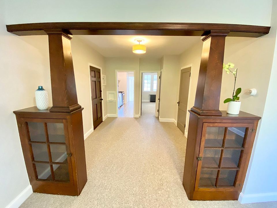 view from living room toward entryway, kitchen and bedroom