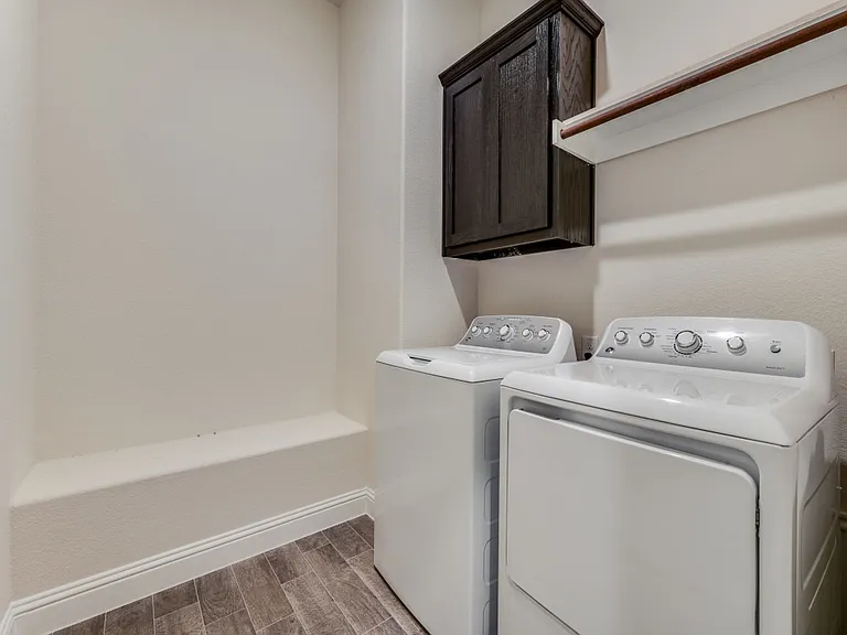 Laundry room with washer and dryer included