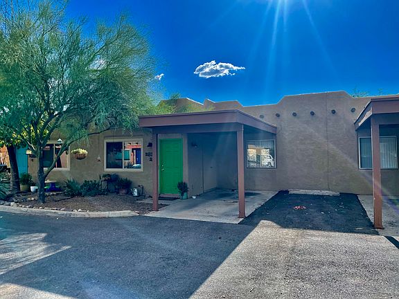 Carport and parking spot next to it