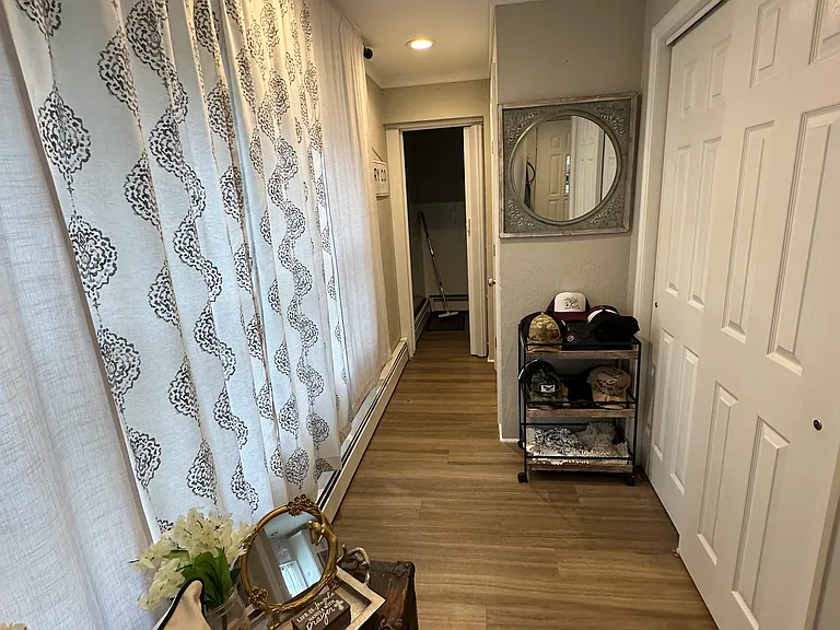 Foyer with Coat Closet, Storage Room & Laundry