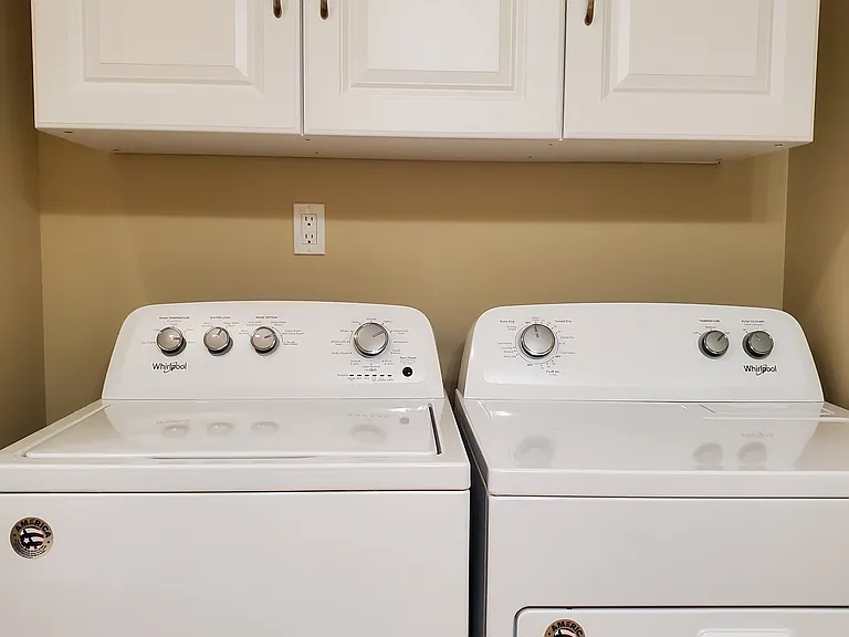 Full size washer and dryer in apartment.