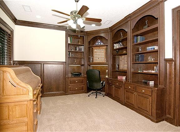 This handsome study with quality built-ins is large enough to accommodate both working and lounging areas.