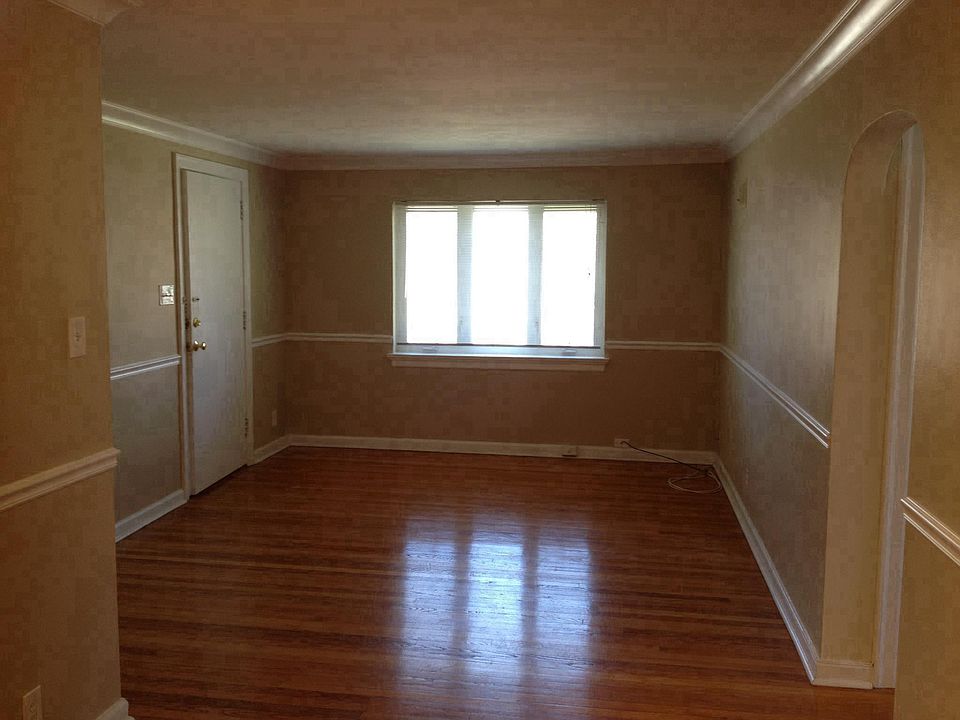 Front Door leading into Living Room. Newer Casement windows.