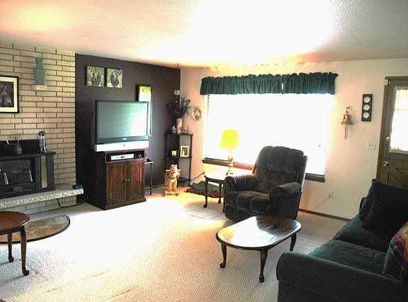 Large picture windows let the sun shine in