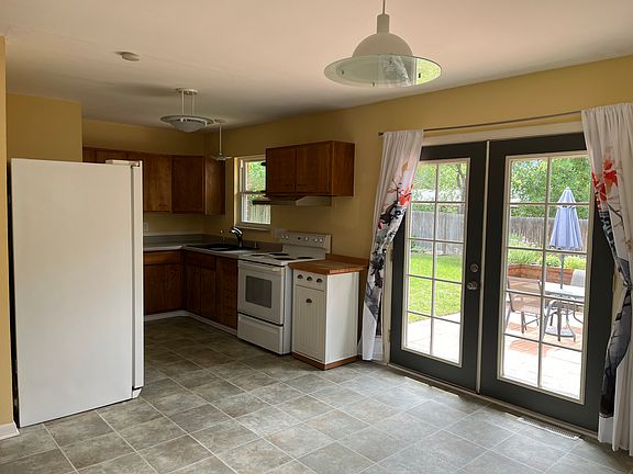Kitchen & Dining area with French Doors leading to the porch and backyard.