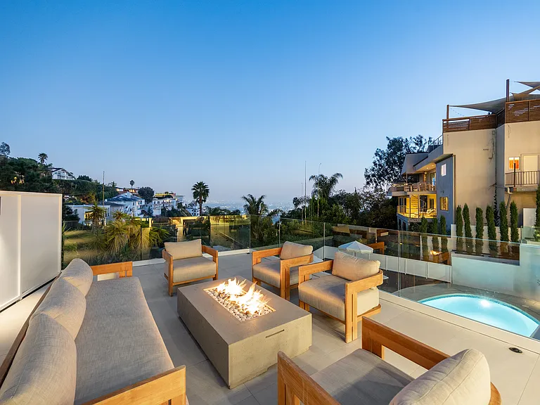 Experience warmth and elegance with a sleek fire pit centerpiece.
