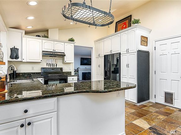 More cabinets and a pantry. Vaulted ceilings and skylights in the kitchen. 