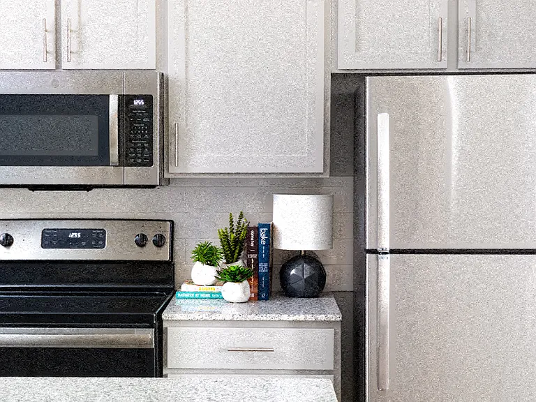 Kitchens with premium granite countertops and stainless steel appliances