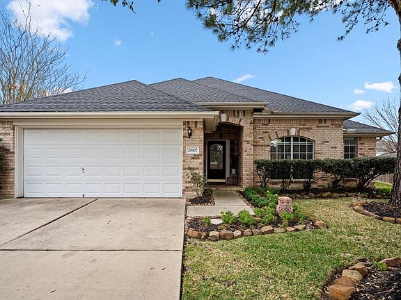 Check out this amazing curb appeal! The front of the home showcases a manicured & well maintained yard w/ fresh pops of greenery highlighted against the beautiful neutral brick of the home's exterior.