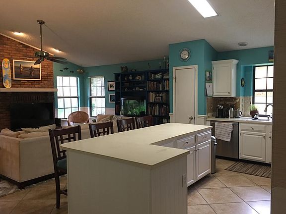 Large island in kitchen (old). Has granite counters.