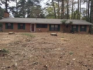 Front view of house/stump will be removed