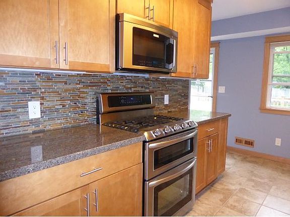 A PERFECT BALANCE With plenty of cupboards & workspace with a touch of style!