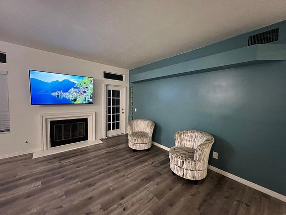 Access to attached patio from living room and master. *Furniture & TV not included.