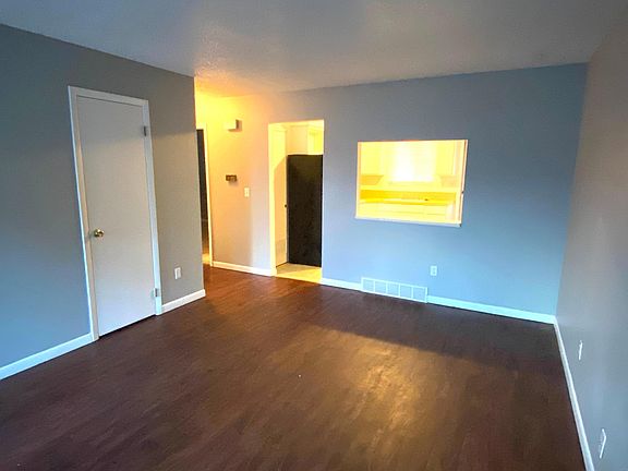 Living room, kitchen behind. Hall to bath & 2 bedrooms to the left.