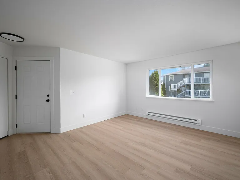 Step into this sunlit modern living space, perfect for personal touches and creativity.