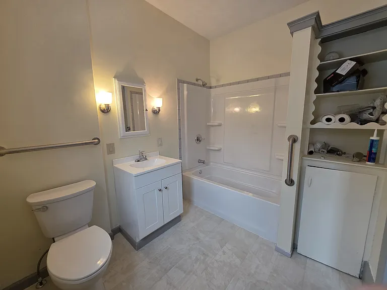 2nd upstairs bath with linen closet storage area.