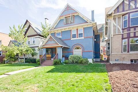Front of house - landscaping has since been done, with large tree and foliage in the front yard to shade the house.