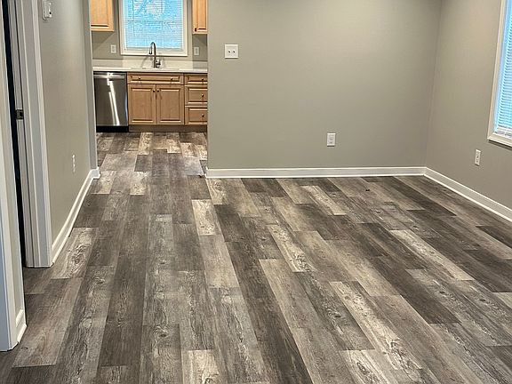 View of living/dining area from the front door