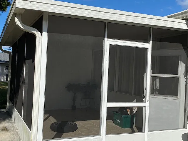 Outside of porch. Enclosed with screen.