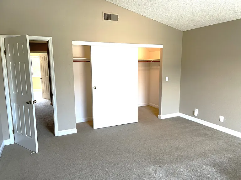 Master bedroom with vaulted ceiling