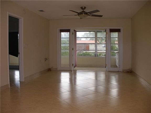 Living area looking out to lanai which overlooks garden 