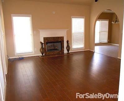 Open floor plan
						:
						Family room & kitchen eating area from foyer. Beautiful wide plank floors.
