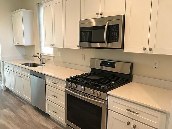 Kitchen with Quartz countertops and stainless appliances
