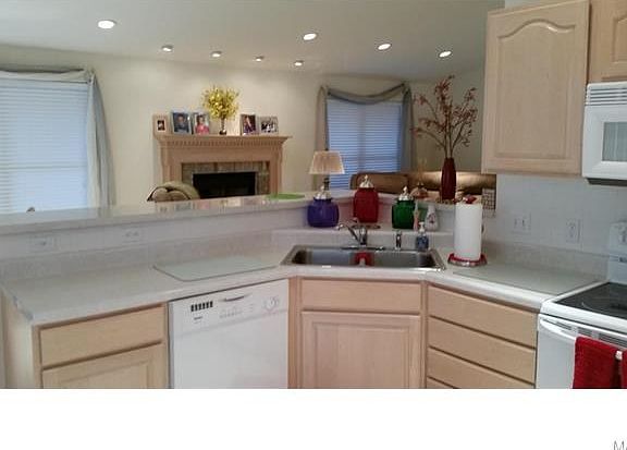 Light bright kitchen open to the great room gives the feel of total spaciousness