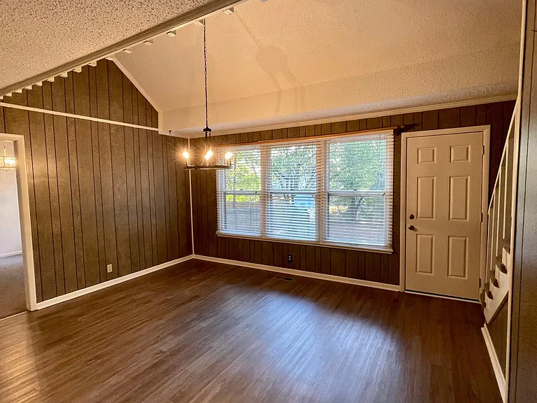 As you walk from the bedrooms down the hallway this is your view entering the kitchen and large breakfast room and even seating area if you so desire. You can see the beautiful view to the back yard and deck. If you look to your right you will see the st