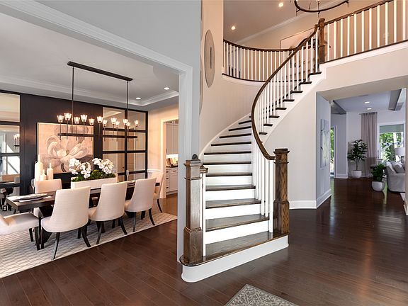 Curved staircase foyer