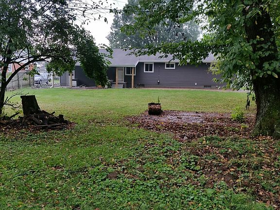 Beautiful scenic backyard with covered porch view the deer