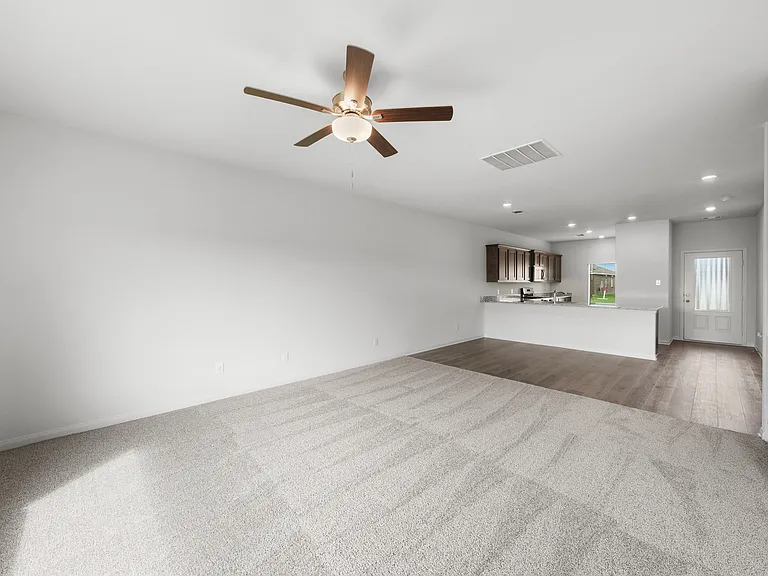 The open layout connects the kitchen with the dining room and family room.