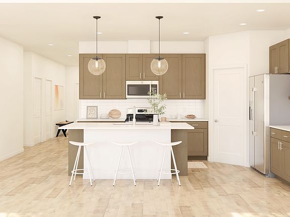 Brushed satin nickel hardware and pendant lighting