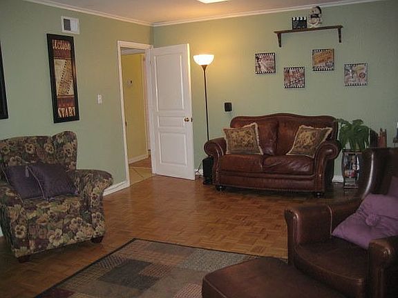 Family room w. wood floors doubles as home theatre & opens to screened porch