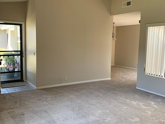Living room features new carpet and front paint