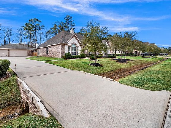 The long, double-wide driveway can accommodate many guests and/or provide plenty of room for kids to ride bikes and toys.