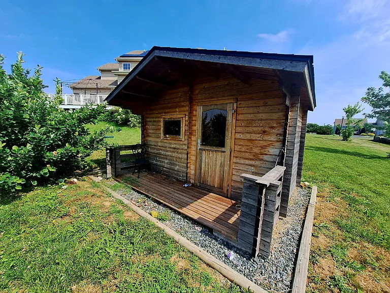 Relax and recharge in the private outdoor sauna, a unique amenity designed to make extended stays even more enjoyable.