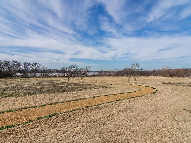 Green belt next to the house that takes you to the lake/ vegetable patch.