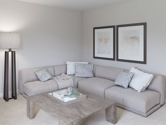 The upstairs loft adds shared living space and leads to all bedrooms on the second floor.